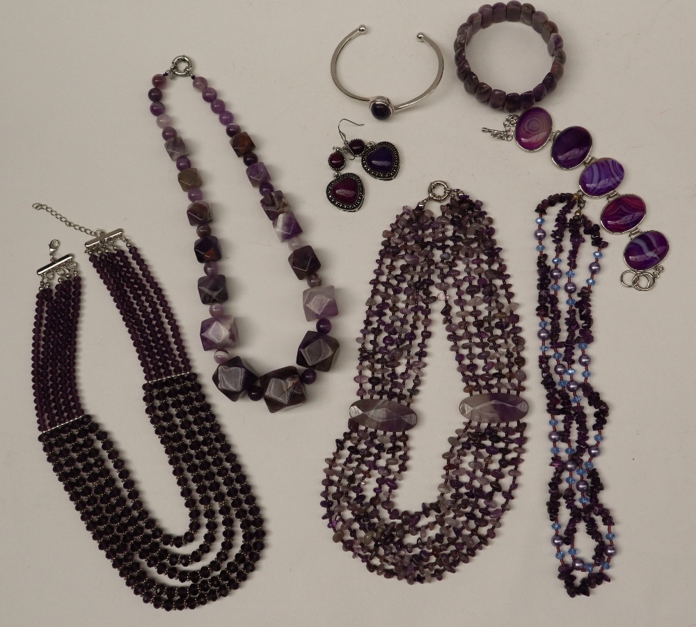 Amethyst set necklaces together with amethyst coloured bracelets etc