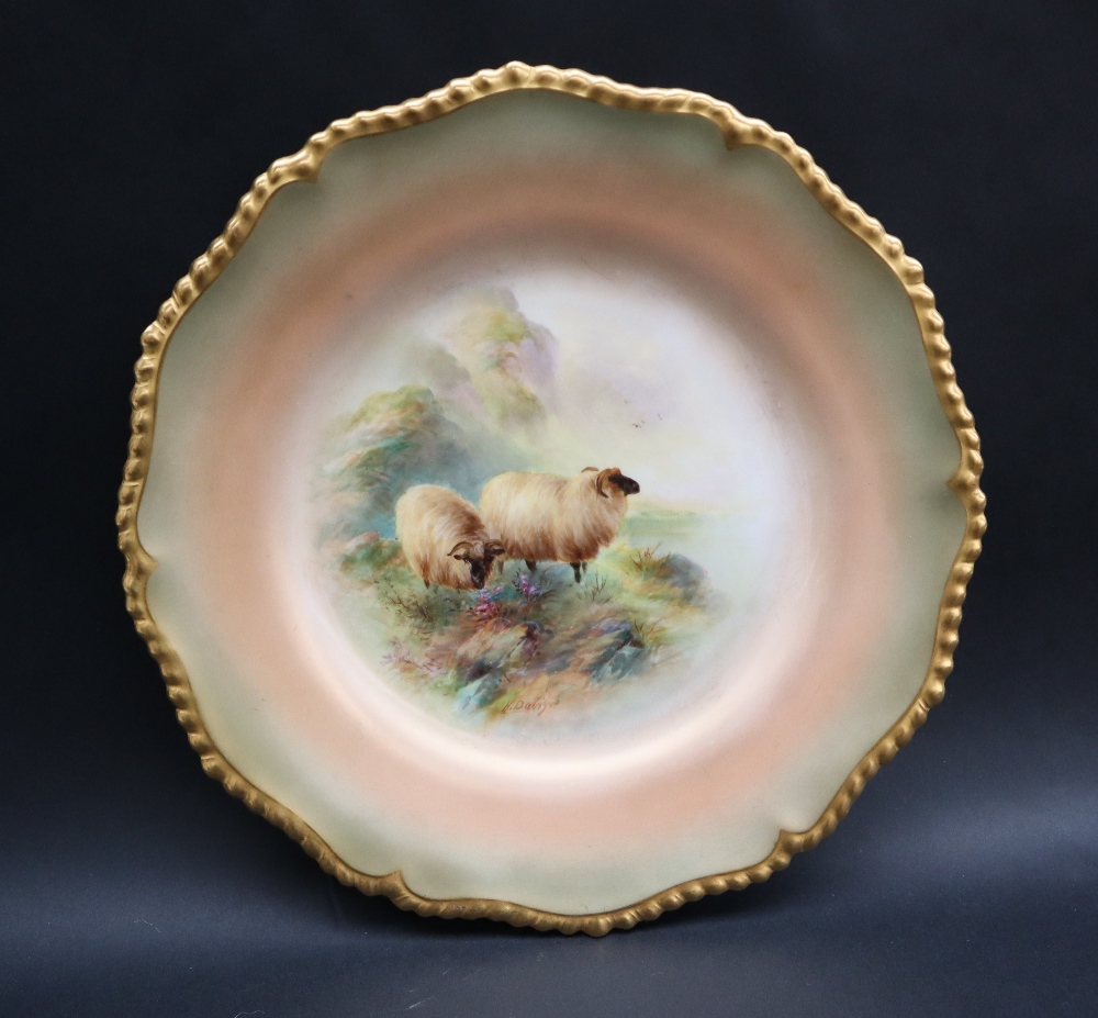 A Royal Worcester cabinet plate with a wavy gilt rim,