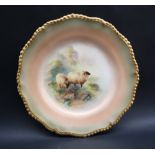 A Royal Worcester cabinet plate with a wavy gilt rim,