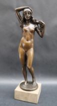 Marcel Kleine A Standing nude female figure with flowers in her hair,