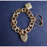 A 9ct yellow gold bracelet with twisted oval links, to a heart shaped padlock clasp,