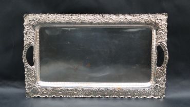 A silver twin handled tray of rectangular form, marks indistinct, 36.