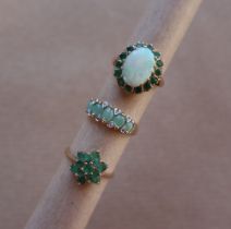 A 9ct gold emerald and opal ring size M 1/2 together with a 9ct gold emerald cluster ring size O
