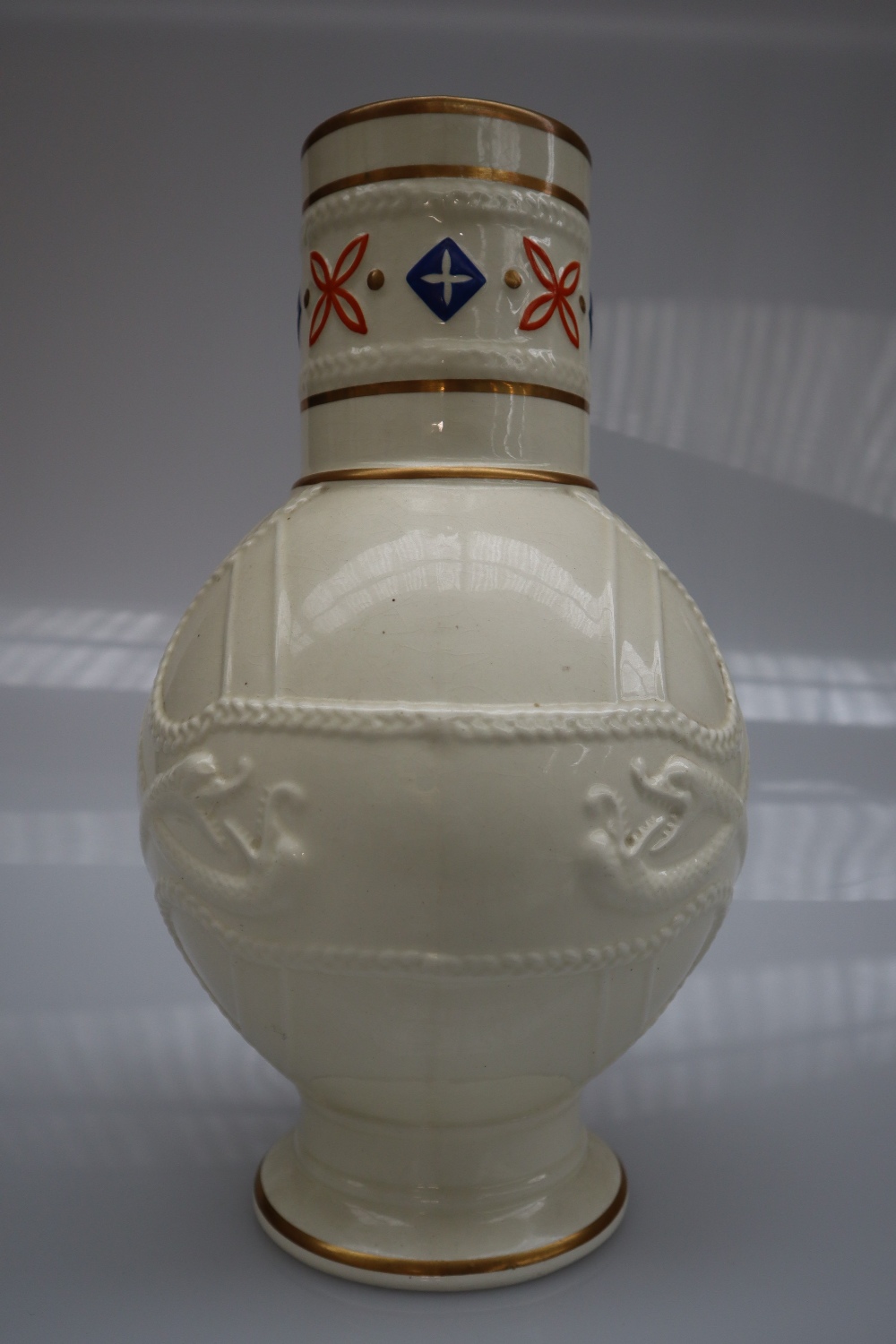 A Victorian pottery creamware jug with a cylindrical neck and bulbous body decorated with serpents - Image 4 of 6