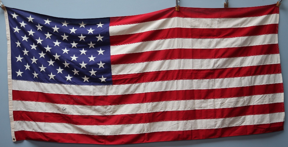 An American Flag, signed by Samuel L. Jackson and Colin Firth.