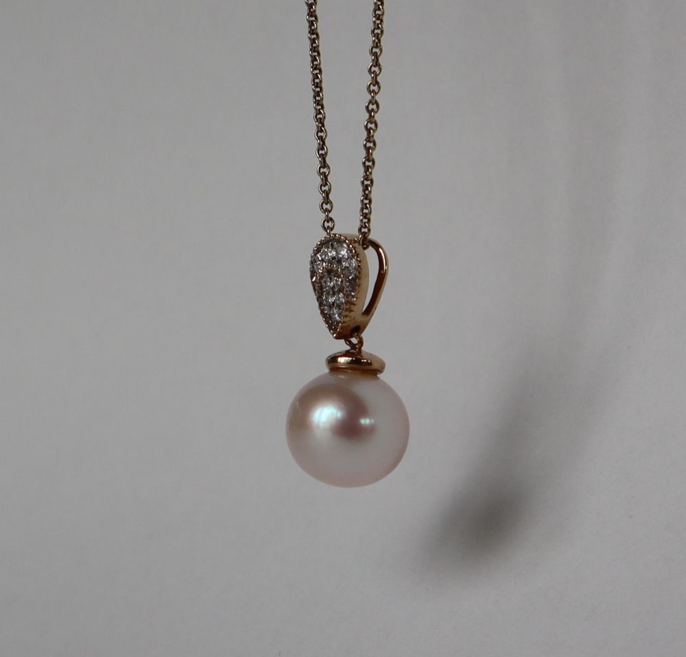 A 9ct yellow gold cultured pearl and diamond inverted pear-shape pendant and chain, - Image 3 of 6