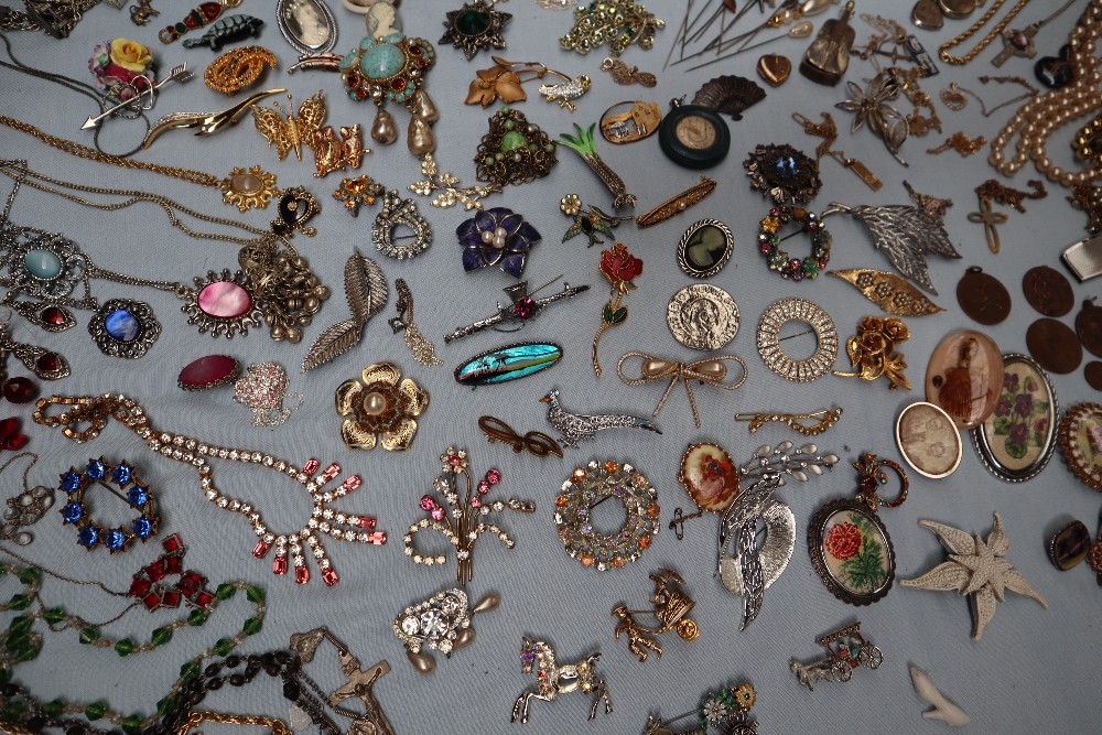 A large collection of costume jewellery including earrings, faux pearl necklaces, rings, medallions, - Image 7 of 7