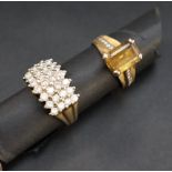 A yellow metal ring set with four rows of round brilliant cut diamonds, size R approximately 8.