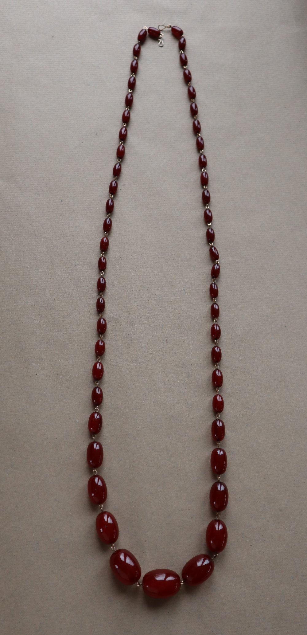 A string of cherry amber / bakelite beads, - Image 3 of 12