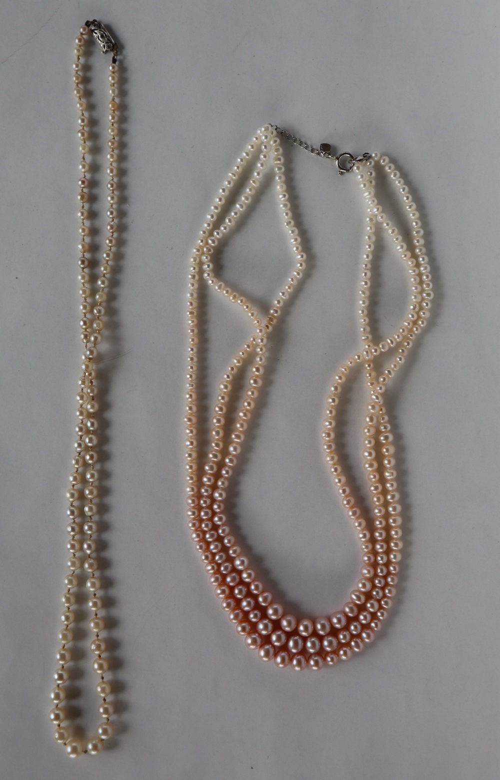 A pearl necklace with graduated pearls, ranging from 6mm to 3mm diameter, to a 9ct white gold clasp, - Image 4 of 5