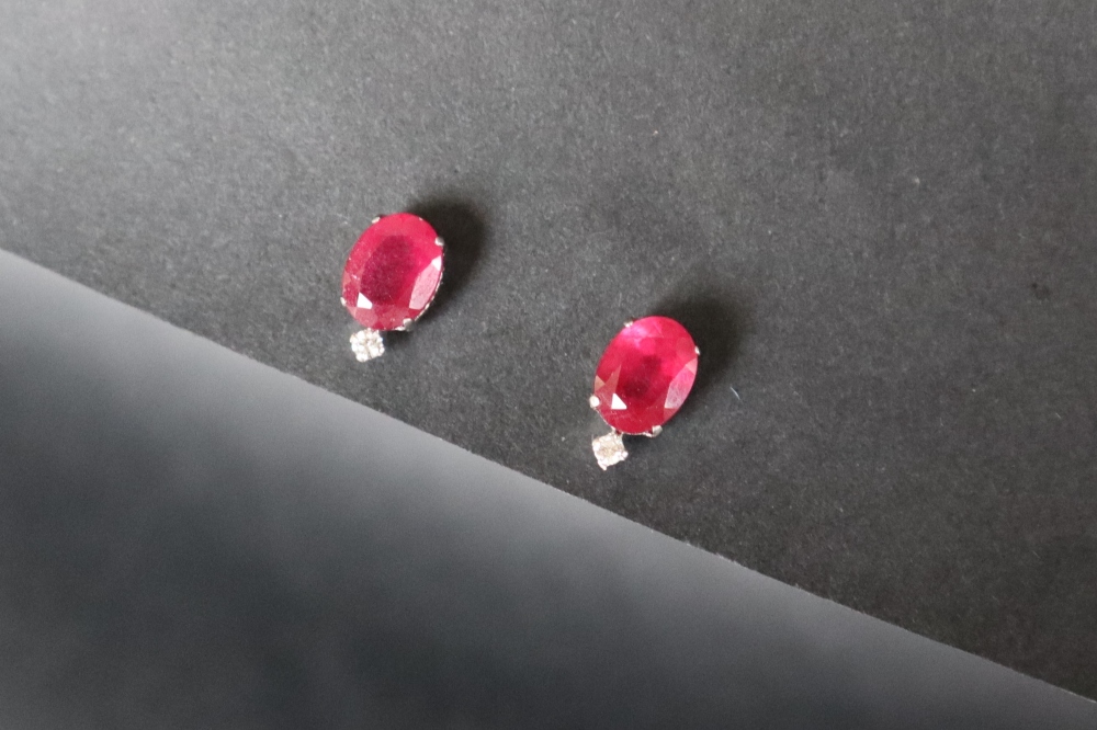 A pair of ruby and diamonds earrings,