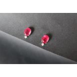 A pair of ruby and diamonds earrings,