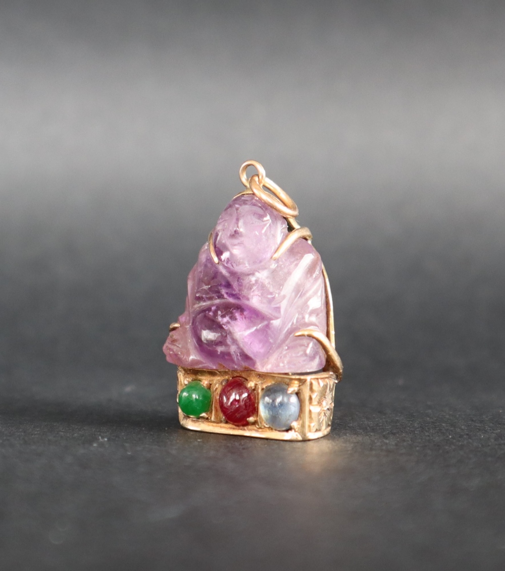 A Chinese amethyst Buddhistic pendant mounted in yellow metal, marked 14k, - Image 2 of 4