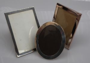 A George V silver photograph frame of oval form, London, 1913,