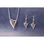 A Clogau silver and gold detailed "Heartstrings" harp shaped pendant on a chain,