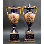 A pair of Vienna style twin handled vases and covers,