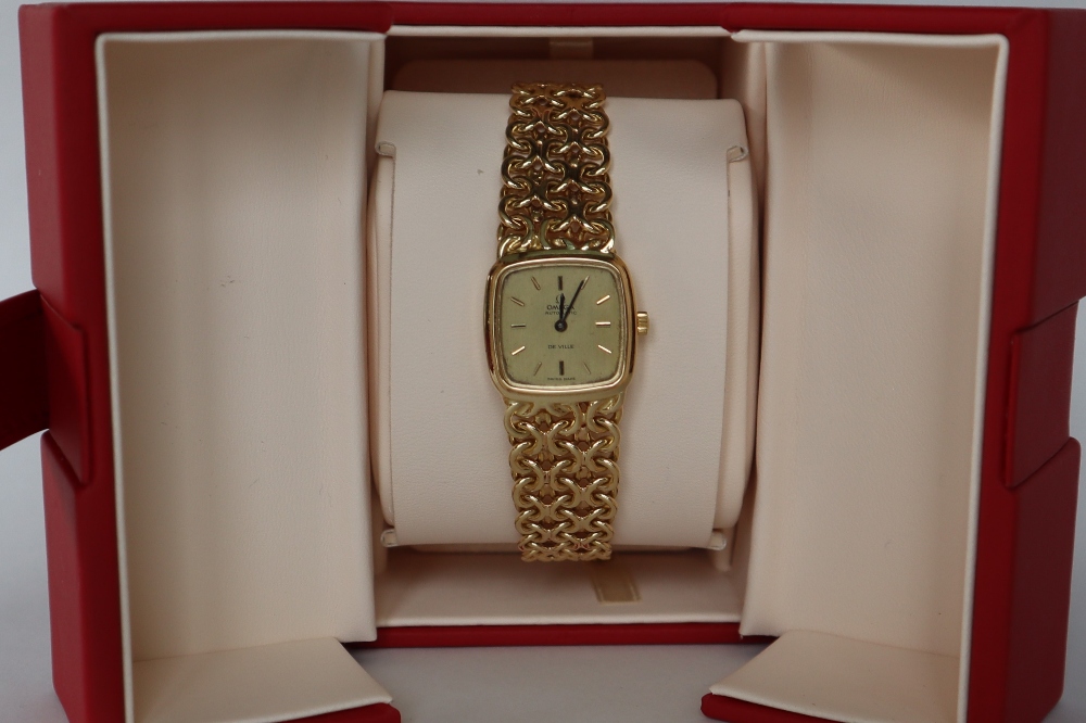 A lady's 18ct gold Omega Automatic De Ville wristwatch with a square dial and batons on an 18ct