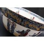 A Bishop and Stonier pottery bowl decorated with Shakespearean figures carrying a hogs head,