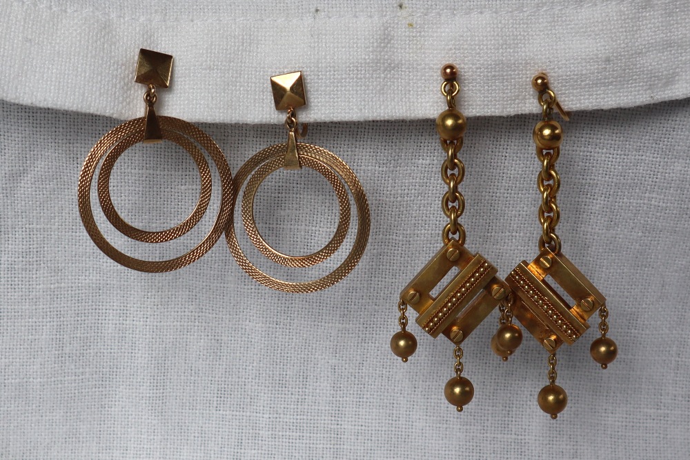 A pair of 9ct gold double hoop drop earrings together with a pair of 9ct gold earrings of square