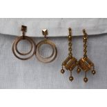 A pair of 9ct gold double hoop drop earrings together with a pair of 9ct gold earrings of square