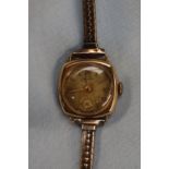 A lady's 9ct gold Movado wristwatch with a circular gilt dial and Roman numerals