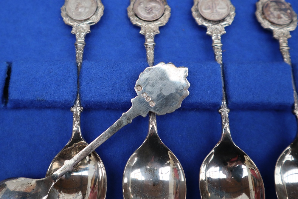 A set of twelve silver zodiac spoons, sculpted by David Cornell by John Pinches, with certificate, - Bild 2 aus 4