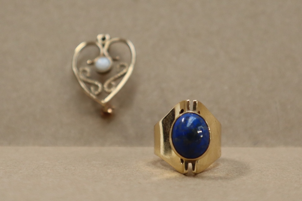 A 9ct gold ring set with a lapis lazuli panel, size K, together with a 9ct gold opal set brooch,