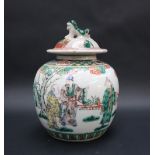 A Chinese Famille Verte porcelain vase and cover, the domed cover with a dog of foo finial,