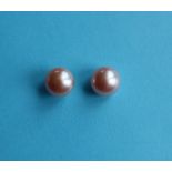 A pair of 9ct yellow gold studs set with oblate spheroid pink cultured pearls