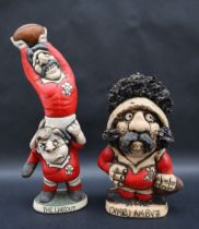 A John Hughes pottery Grogg depicting two Welsh Rugby players,