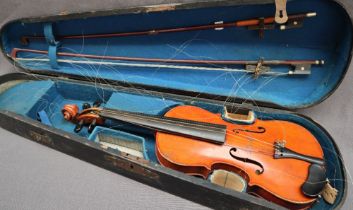 A child's violin, with a two piece back and ebony stringing,