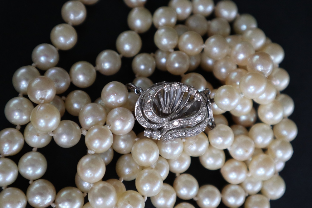 A double strand pearl necklace set with one hundred and twenty one regular pearls to a white metal - Image 2 of 5