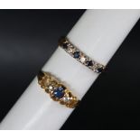 An 18ct yellow gold ring set with four round faceted sapphires and three round brilliant cut