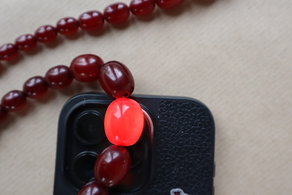 Two Cherry Amber / bakelite bead necklaces, ranging in size from 30mm to 10mm, 79cm long, - Image 7 of 12