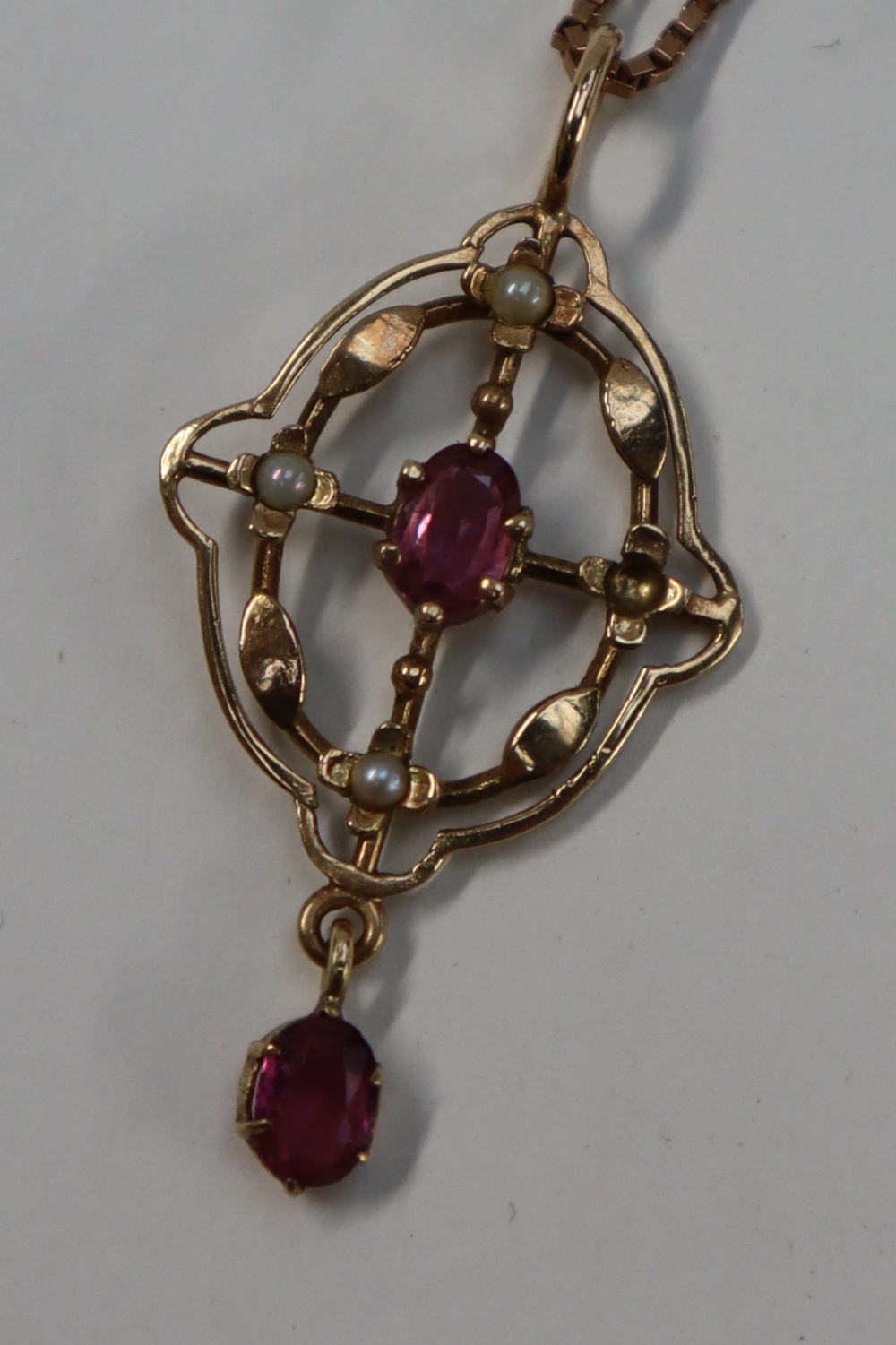 A 9ct gold ruby and seed pearl pendant on a 9ct gold chain together with 9ct gold necklaces, - Image 2 of 4