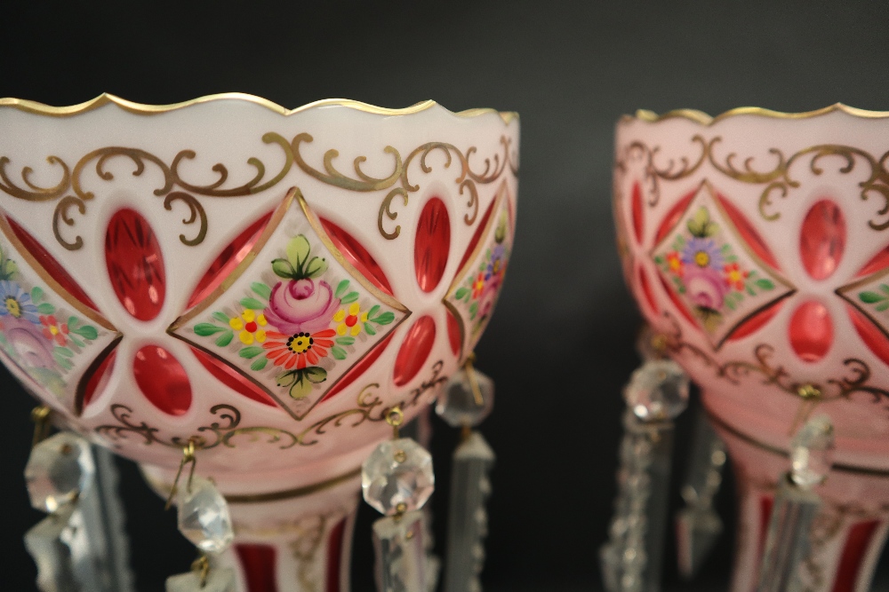 A pair of Victorian ruby and white flash glass table lustres painted with flowers and leaves, 29. - Image 2 of 4