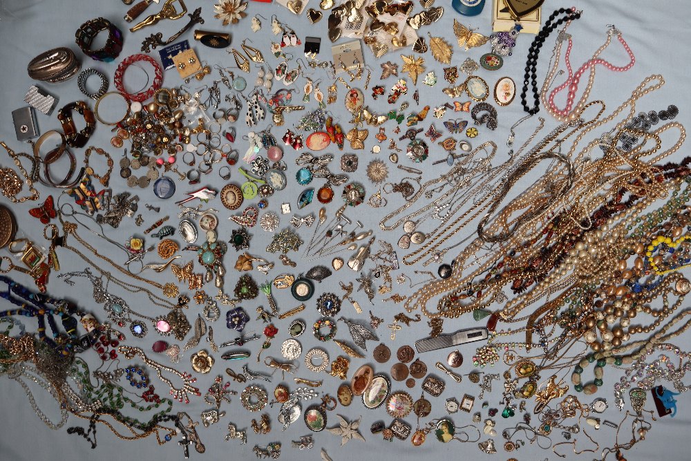 A large collection of costume jewellery including earrings, faux pearl necklaces, rings, medallions, - Image 2 of 7