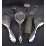 A George V silver hand mirror with matching brush, Birmingham,