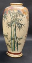 A Japanese satsuma pottery vase of tapering rectangular form painted with a landscape scene,
