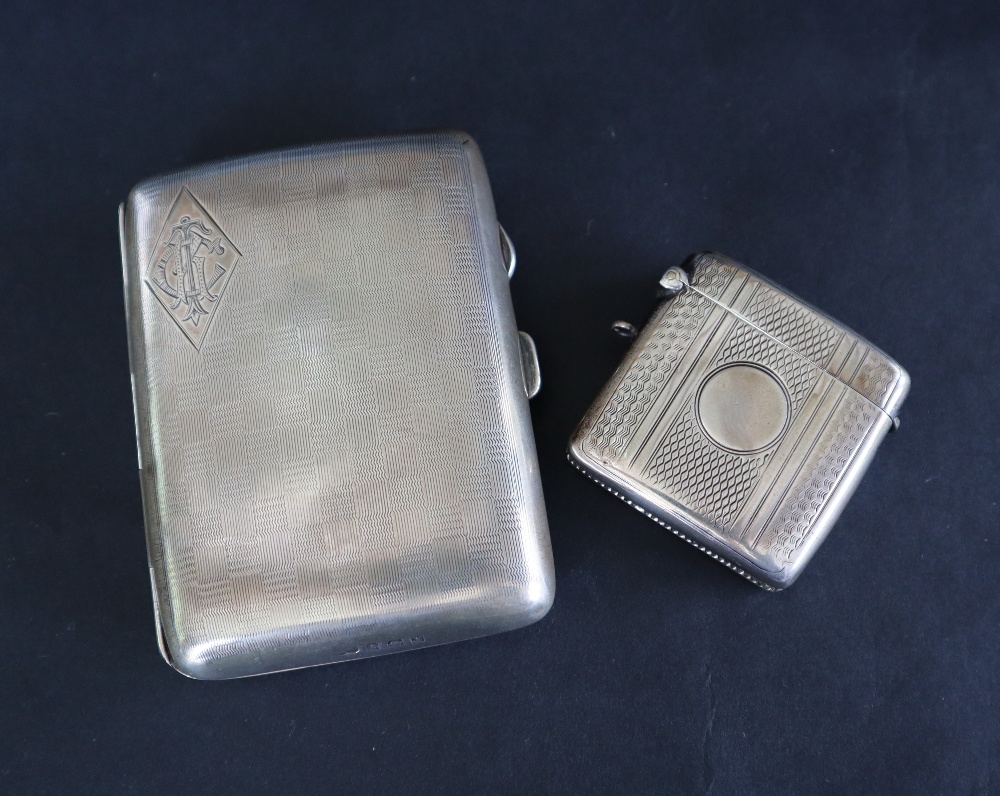 A George V silver cigarette case of rectangular form with a chequer board pattern and initials,