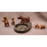 A Black Forest bear pin tray together with four assorted carved bears