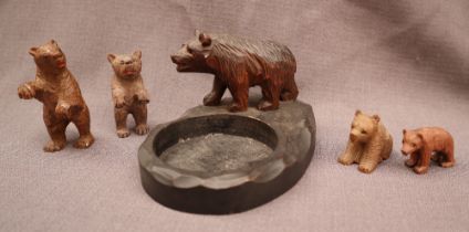 A Black Forest bear pin tray together with four assorted carved bears