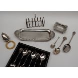 A set of six George V cased silver coffee spoons, Birmingham, 1925 together with a rattle,