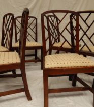 A set of six George III mahogany dining chairs, the beaded arched backs with fretted infill,
