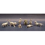 A silver miniature model of a bull, together with a silver cat, silver bird, silver fox,