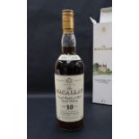 A bottle of The Macallan Single Highland Malt Scotch Whisky 10 Years Old,