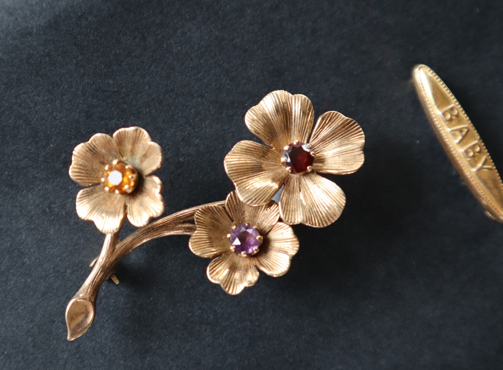 A 9ct gold brooch of floral form set with a garnet, - Image 2 of 4