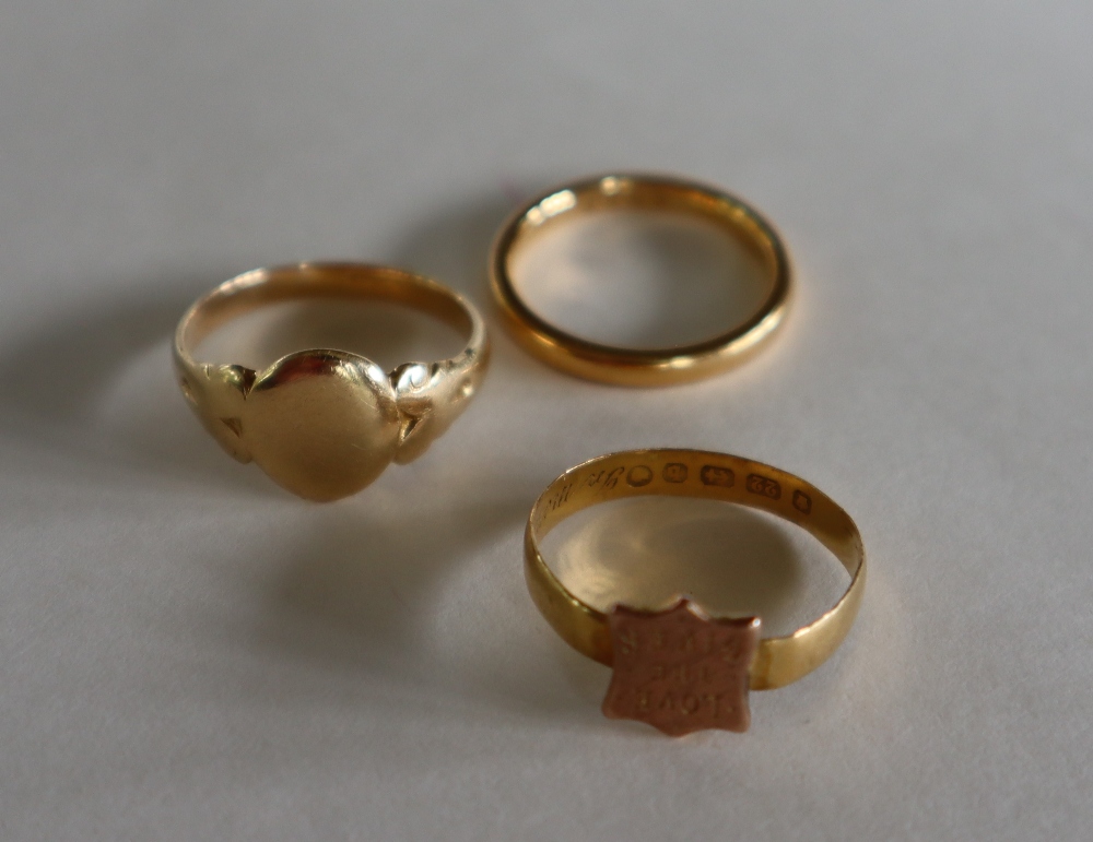 A 22ct gold wedding band, size I, together with a 22ct gold shield ring "Love the Giver", size K, - Image 2 of 2