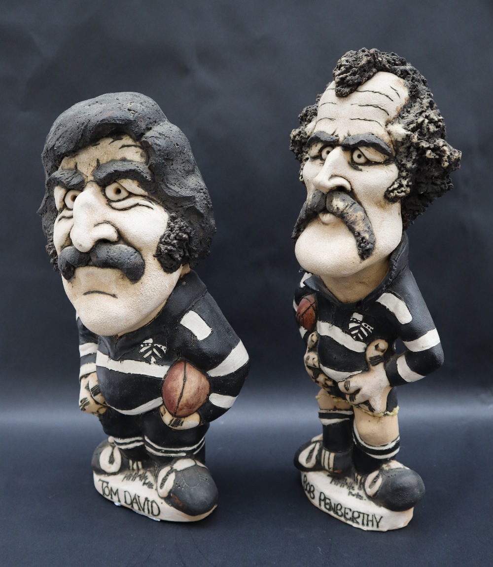 A John Hughes pottery Grogg of Tom David in Pontypridd kit, holding a hall under his left arm,