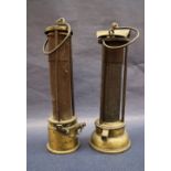 A 19th century brass Davy lamp, with an arched top and gauze shield on a screwed on brass base, 24.